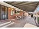 View of the covered patio and outdoor seating area in backyard, perfect for entertaining or relaxing outdoors at 3395 W Union Ave, Englewood, CO 80110