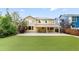 Spacious backyard with lush artificial turf, patio area, and a well-maintained lawn at 13262 Elizabeth St, Thornton, CO 80241
