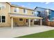 Covered patio is great for outdoor entertaining and relaxing with views of the grassy backyard at 13262 Elizabeth St, Thornton, CO 80241
