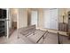 Bedroom with neutral walls, carpet and double closet, open to a bathroom at 13262 Elizabeth St, Thornton, CO 80241