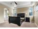 Bright bedroom features neutral walls, carpet, ceiling fan, and multiple windows providing ample natural light at 13262 Elizabeth St, Thornton, CO 80241