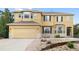 Charming home with a two-car garage, stone accents, bay windows, and nicely landscaped front yard at 13262 Elizabeth St, Thornton, CO 80241