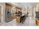 Bright kitchen with stainless steel appliances and tile floors at 13262 Elizabeth St, Thornton, CO 80241