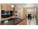 Modern kitchen featuring stainless steel appliances, granite countertops, and ample cabinet space at 13262 Elizabeth St, Thornton, CO 80241