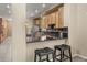 Updated kitchen with granite countertops, stainless steel appliances, and ample cabinet space at 13262 Elizabeth St, Thornton, CO 80241
