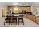 Well-appointed kitchen with granite countertops, stainless steel appliances, and tile floors at 13262 Elizabeth St, Thornton, CO 80241