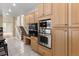 Contemporary kitchen featuring stainless steel appliances, and ample storage at 13262 Elizabeth St, Thornton, CO 80241