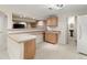Bright kitchenette area features countertops and a sink, with a refrigerator in view at 13262 Elizabeth St, Thornton, CO 80241