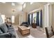 Open-concept living room featuring soaring ceilings, clerestory windows, and lots of natural light at 13262 Elizabeth St, Thornton, CO 80241