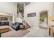 Spacious living room with high ceilings, grand staircase, and access to other living spaces at 13262 Elizabeth St, Thornton, CO 80241