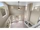 Spacious living room featuring vaulted ceilings, large windows, and a cozy fireplace at 13262 Elizabeth St, Thornton, CO 80241