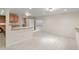 Spacious lower level with kitchenette, and versatile open area with recessed lighting at 13262 Elizabeth St, Thornton, CO 80241