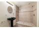 Updated shower featuring stone tiles, a glass door and modern fixtures at 13262 Elizabeth St, Thornton, CO 80241