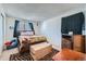 Bright bedroom featuring a bed, and a zebra rug on the floor at 1864 S Pitkin Cir # B, Aurora, CO 80017