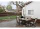 Backyard features a patio set, charcoal grill and green space at 2356 S Franklin St, Denver, CO 80210