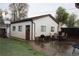 Backyard area features a patio set, charcoal grill and basketball hoop at 2356 S Franklin St, Denver, CO 80210
