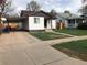 Charming single-Gathering home with carport, well-maintained lawn, and traditional design at 2356 S Franklin St, Denver, CO 80210