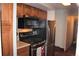 Kitchen with stainless steel appliances, wooden cabinets and a gas range at 2356 S Franklin St, Denver, CO 80210