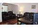 Inviting living room with plush, dark couches and wood flooring at 2356 S Franklin St, Denver, CO 80210