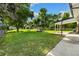 Expansive backyard featuring lush lawn and mature trees perfect for outdoor activities and relaxing at 5193 Zinnia St, Arvada, CO 80002