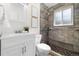 Bathroom features a modern vanity and tiled shower at 5193 Zinnia St, Arvada, CO 80002