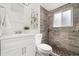 Bathroom features a modern vanity and tiled shower at 5193 Zinnia St, Arvada, CO 80002
