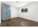 Bedroom featuring hardwood floors and one window at 5193 Zinnia St, Arvada, CO 80002