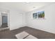 A sunlit bedroom with a closet, window, and plush carpeting provides a cozy retreat at 5193 Zinnia St, Arvada, CO 80002