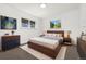 Bedroom with a modern bed and two windows at 5193 Zinnia St, Arvada, CO 80002