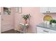 Charming kitchen nook with a cozy table, soft pink walls, and natural light at 5193 Zinnia St, Arvada, CO 80002