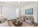 Living room featuring hardwood floors and ample seating at 5193 Zinnia St, Arvada, CO 80002