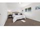 Serene main bedroom with plush carpeting, a comfortable bed, and soft, natural lighting at 5193 Zinnia St, Arvada, CO 80002