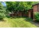 Brick home exterior with large tree at 5401 E Dakota Ave # 22, Denver, CO 80246