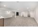 Spacious finished basement featuring plush gray carpet and modern recessed lighting throughout at 5401 E Dakota Ave # 22, Denver, CO 80246