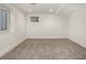 Unfinished basement with carpet and windows, providing a blank canvas for customization and extra living space at 5401 E Dakota Ave # 22, Denver, CO 80246