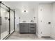 Bathroom featuring modern gray vanity, a tiled floor, and a stylish glass enclosed shower at 5401 E Dakota Ave # 22, Denver, CO 80246
