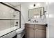 Updated bathroom with shower, bathtub, and modern vanity at 5401 E Dakota Ave # 22, Denver, CO 80246