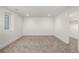 Finished bedroom features plush gray carpeting, modern recessed lighting and a window at 5401 E Dakota Ave # 22, Denver, CO 80246