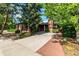 Charming single-story brick home featuring mature trees, landscaped yard, and a driveway at 5401 E Dakota Ave # 22, Denver, CO 80246