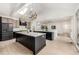 Bright modern kitchen featuring dual skylights, a large island with seating, stainless steel appliances at 5401 E Dakota Ave # 22, Denver, CO 80246