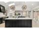Bright, modern kitchen with dual skylights, an oversized island with seating, and stainless steel appliances at 5401 E Dakota Ave # 22, Denver, CO 80246