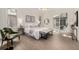 Bright main bedroom with light hardwood floors and a glass sliding door to outdoor living area at 5401 E Dakota Ave # 22, Denver, CO 80246