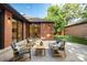 Brick home with outdoor patio area with seating, perfect for entertaining and relaxation at 5401 E Dakota Ave # 22, Denver, CO 80246