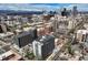 Scenic aerial view captures an expansive cityscape with mountain views in the background at 909 N Logan St # 11A, Denver, CO 80203