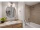 Bright bathroom featuring a vanity and a tiled shower-tub combo with nice finishes at 909 N Logan St # 11A, Denver, CO 80203