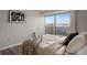 Bright bedroom featuring a sliding glass doors, modern flooring, and neutral decor at 909 N Logan St # 11A, Denver, CO 80203