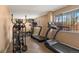 Well-equipped gym featuring treadmills, elliptical, and weight bench for a convenient workout at 909 N Logan St # 11A, Denver, CO 80203