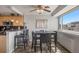 Dining area with bar stool seating and large windows offering city views off of the kitchen at 909 N Logan St # 11A, Denver, CO 80203