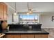 Breakfast bar with pendant lighting offering views of the city from the kitchen area at 909 N Logan St # 11A, Denver, CO 80203