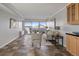 Bright living room featuring tile flooring, a sliding glass door with balcony, and modern furniture at 909 N Logan St # 11A, Denver, CO 80203